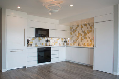 Example of a mid-sized minimalist l-shaped porcelain tile and brown floor eat-in kitchen design in San Diego with an undermount sink, flat-panel cabinets, white cabinets, quartz countertops, multicolored backsplash, ceramic backsplash, black appliances and no island