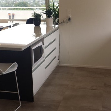 Gloss Laminate benchtops with White and Dark Wood cabinetry