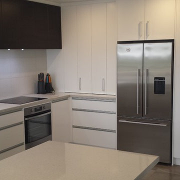 Gloss Laminate benchtops with White and Dark Wood cabinetry