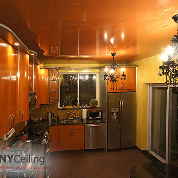 Glossy stretch ceiling color of kitchen cabinets