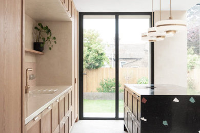 Inspiration for a modern open plan kitchen in London with recessed-panel cabinets, terrazzo worktops, mosaic tiled splashback, an island and a built-in sink.