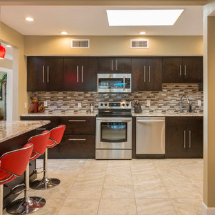 Contemporary kitchen in Tampa with an undermount sink, flat-panel cabinets, dark wood cabinets, brown splashback, matchstick tile splashback, stainless steel appliances, with island, beige floor and brown benchtop.