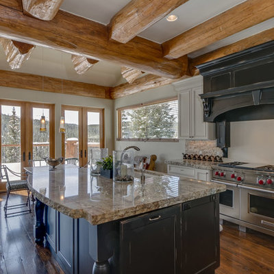 Mid-sized mountain style l-shaped dark wood floor and brown floor eat-in kitchen photo in Other with an undermount sink, recessed-panel cabinets, black cabinets, stainless steel appliances, an island and granite countertops