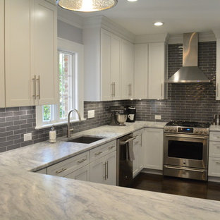 Eat-in kitchen - modern dark wood floor eat-in kitchen idea in Richmond with white cabinets, granite countertops, gray backsplash, subway tile backsplash, stainless steel appliances and no island
