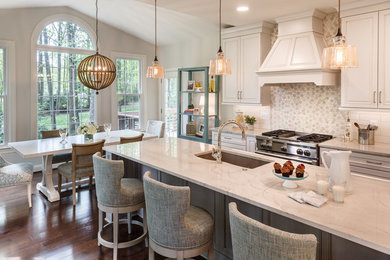 Example of a large transitional dark wood floor and brown floor eat-in kitchen design in DC Metro with white cabinets, multicolored backsplash, an island and white countertops