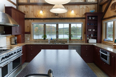 Example of a mid-sized farmhouse u-shaped ceramic tile eat-in kitchen design in Bridgeport with an undermount sink, shaker cabinets, dark wood cabinets, granite countertops, beige backsplash, cement tile backsplash, stainless steel appliances and an island