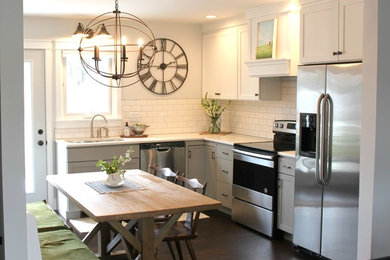 Inspiration for a small transitional l-shaped dark wood floor and brown floor eat-in kitchen remodel in Other with a double-bowl sink, recessed-panel cabinets, white cabinets, solid surface countertops, white backsplash, subway tile backsplash, stainless steel appliances, no island and white countertops