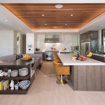 Gourmet Modern Open Kitchen with Banquette and Island