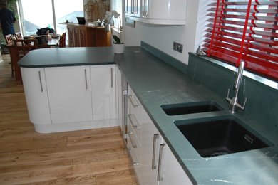 Inspiration for a kitchen in Other with stone slab splashback.