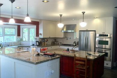 Inspiration for a modern eat-in kitchen remodel in San Diego with shaker cabinets, red cabinets, granite countertops, white backsplash, ceramic backsplash and stainless steel appliances