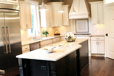 Trendy kitchen photo in Detroit with recessed-panel cabinets, white cabinets and stainless steel appliances