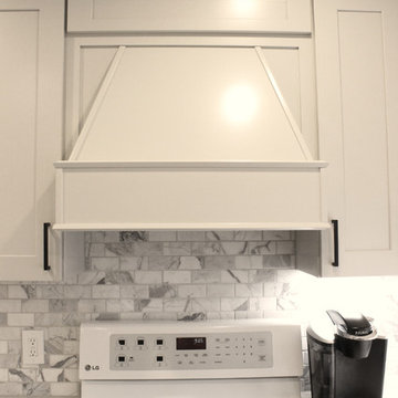 Gray and White Kitchen with Eternia Quartz and Marble Mosaic Backsplash