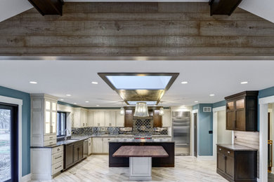 Mid-sized transitional u-shaped light wood floor, white floor and wood ceiling eat-in kitchen photo in Chicago with wood countertops and an island