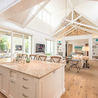 Great room with paneled walls, 27' Ceilings, clerestory windows and exposed raft
