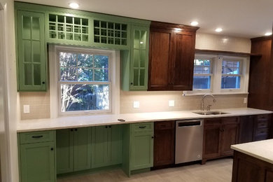 Inspiration for a large transitional galley ceramic tile and beige floor eat-in kitchen remodel in Louisville with an undermount sink, flat-panel cabinets, dark wood cabinets, quartz countertops, white backsplash, ceramic backsplash, stainless steel appliances and white countertops