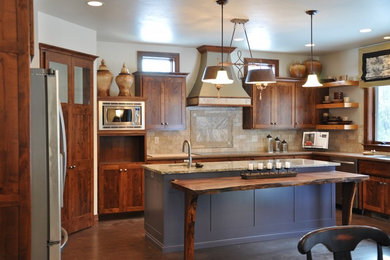 Example of a mid-sized classic u-shaped medium tone wood floor eat-in kitchen design in Other with an undermount sink, flat-panel cabinets, medium tone wood cabinets, wood countertops, beige backsplash, stone tile backsplash, stainless steel appliances and an island