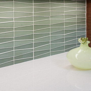 Green Glass Tile Backsplash And White Countertop