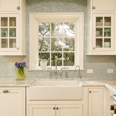 Kitchen - traditional kitchen idea in DC Metro with shaker cabinets, mosaic tile backsplash, a farmhouse sink, quartzite countertops, white cabinets and blue backsplash