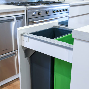 White and timber kitchen will pull out bin drawer