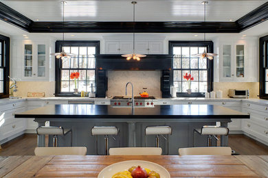 Eat-in kitchen - huge u-shaped dark wood floor eat-in kitchen idea in New York with a farmhouse sink, shaker cabinets, white cabinets, marble countertops, stone tile backsplash, stainless steel appliances, an island and white backsplash