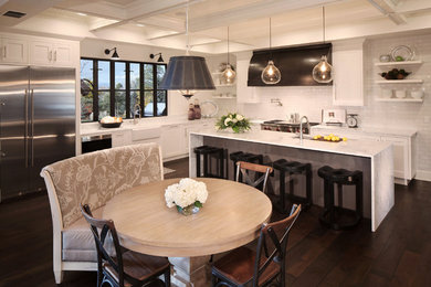 Large transitional l-shaped dark wood floor eat-in kitchen photo in Denver with an undermount sink, white cabinets, marble countertops, white backsplash, subway tile backsplash, stainless steel appliances and an island