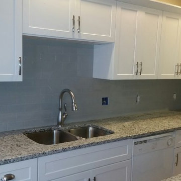 Grey and White Granite Countertop Renovation with Grey Tile Backsplash