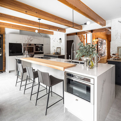 Kitchen - contemporary kitchen idea in Ottawa with an undermount sink, flat-panel cabinets, white cabinets and stainless steel appliances