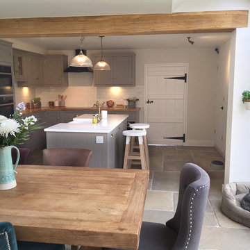 Grey country cottage with island and wooden worktops