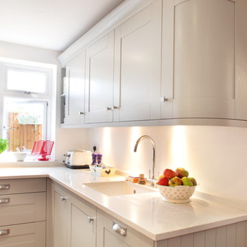 Grey country kitchen with curved cabinets