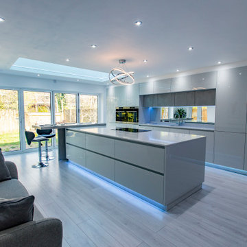 Grey gloss kitchen with concrete