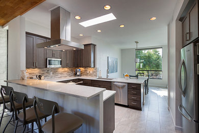 Example of a mid-sized minimalist u-shaped laminate floor eat-in kitchen design in Phoenix with an undermount sink, shaker cabinets, gray cabinets, quartz countertops, gray backsplash, mosaic tile backsplash, stainless steel appliances and no island