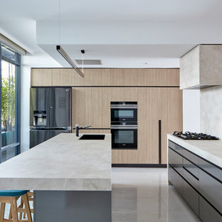 Design ideas for a large modern kitchen in Brisbane with an undermount sink, porcelain floors, multiple islands, grey floor, flat-panel cabinets, grey cabinets, black appliances and beige benchtop.