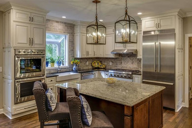 Inspiration for a transitional kitchen remodel in Nashville with an island