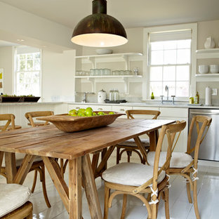 Country eat-in kitchen in New York with open cabinets, white cabinets and stainless steel appliances.