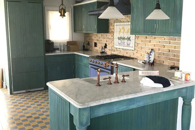 Mid-sized country u-shaped kitchen photo in Other with a farmhouse sink, beaded inset cabinets, marble countertops and brick backsplash
