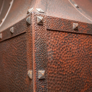 Hammered copper hood detail