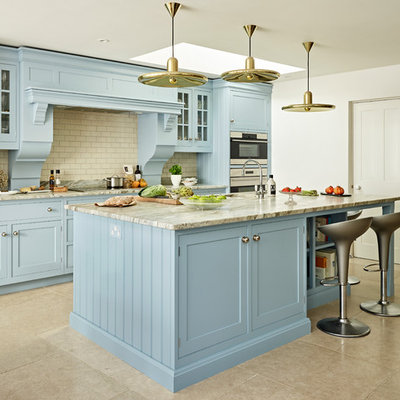 Open concept kitchen - large traditional single-wall gray floor open concept kitchen idea in Oxfordshire with a single-bowl sink, shaker cabinets, blue cabinets, granite countertops, stainless steel appliances, an island, white backsplash, subway tile backsplash and gray countertops