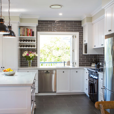 Inspiration for a large timeless l-shaped ceramic tile and gray floor open concept kitchen remodel in Brisbane with an undermount sink, shaker cabinets, white cabinets, quartz countertops, gray backsplash, black appliances and an island