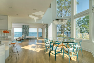 Example of a beach style kitchen/dining room combo design in New York