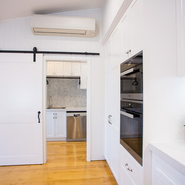 Hamptons kitchen with combined butlers pantry and laundry