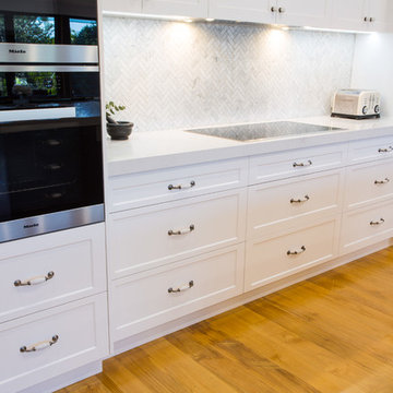 Hamptons kitchen with combined butlers pantry and laundry