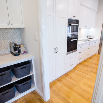 Hamptons kitchen with combined butlers pantry and laundry