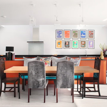 Handle-less burnt orange kitchen/dining space