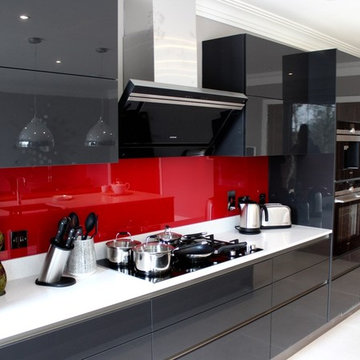 Handle-less dark grey kitchen with modern appliances