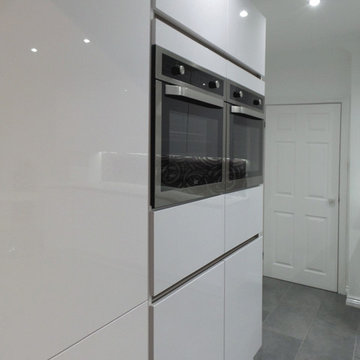 Handle-less gloss kitchen in East Harlsey