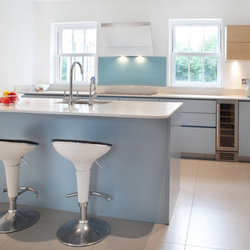 Handle-less matt blue & wood effect kitchen with island