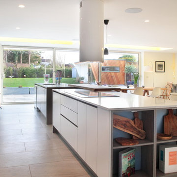 Handle-less matt grey & blue kitchen with cleverly designed storage
