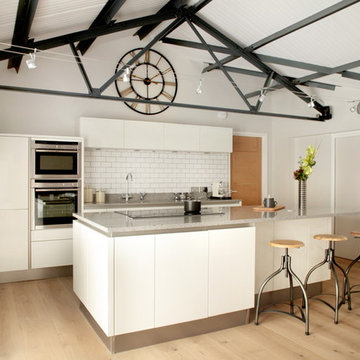 Handle-less white barn conversion kitchen
