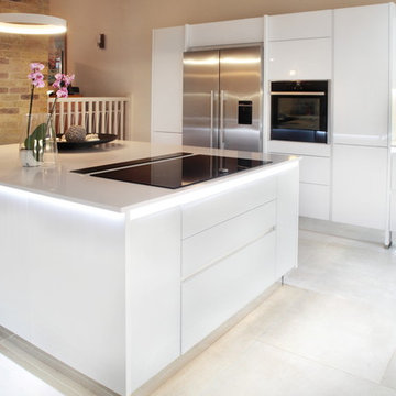 Handle-less white kitchen with island