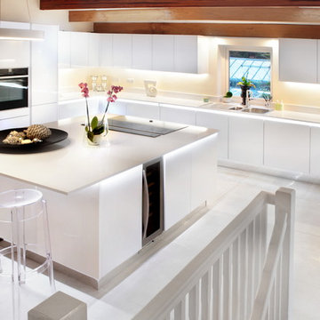 Handle-less white kitchen with LED lighting